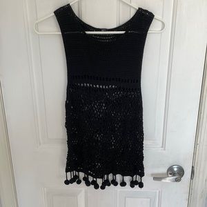 Black crochet tank top with pom-poms around the bottom. Size medium
